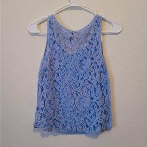 Blue laced back sleeveless blouse by Aviva
Size M